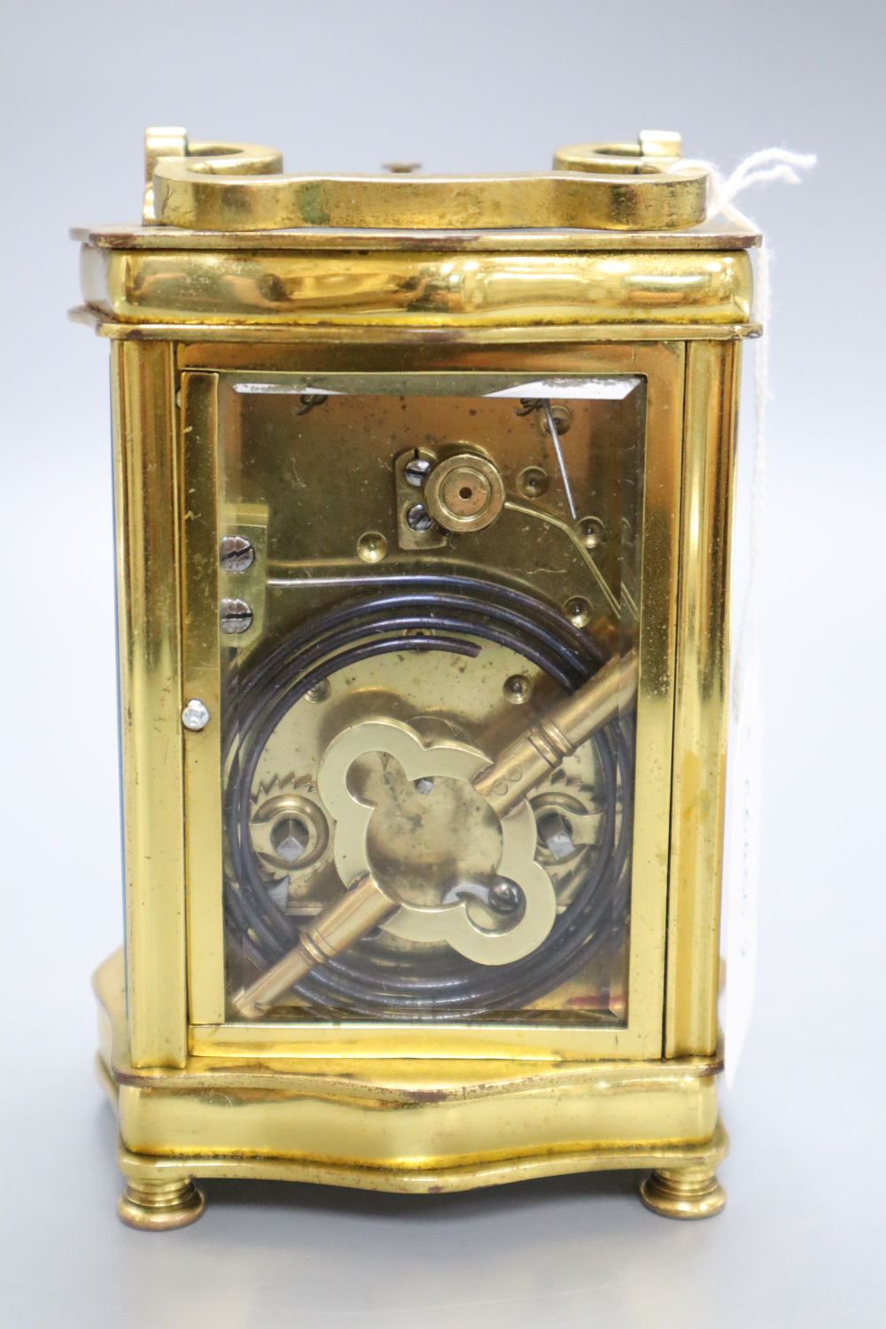 A brass cased carriage clock, height 14cm with handle down